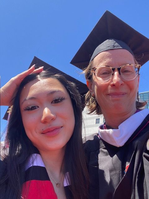Selfie of two students at graduation.