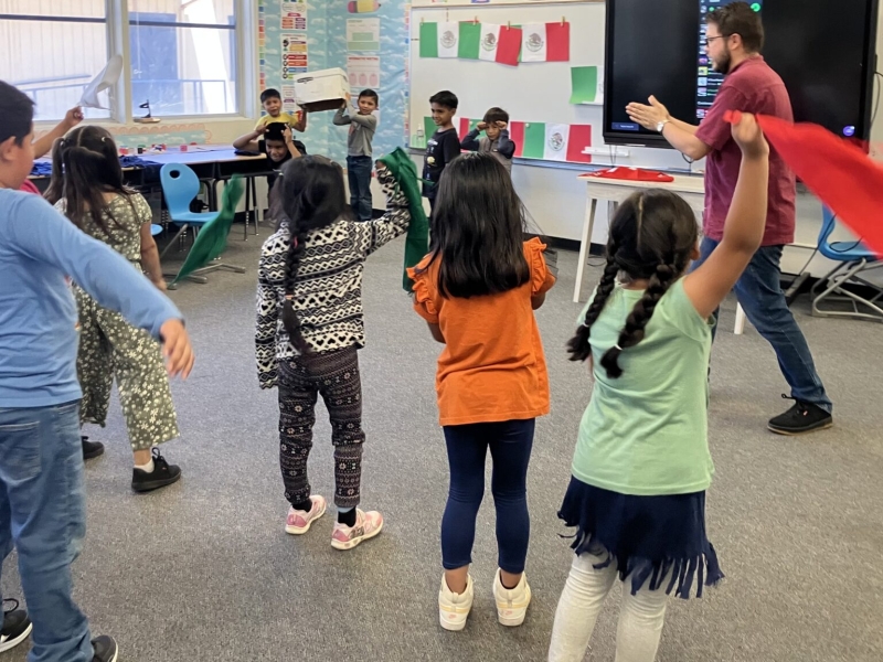 Young students standing in a classroom