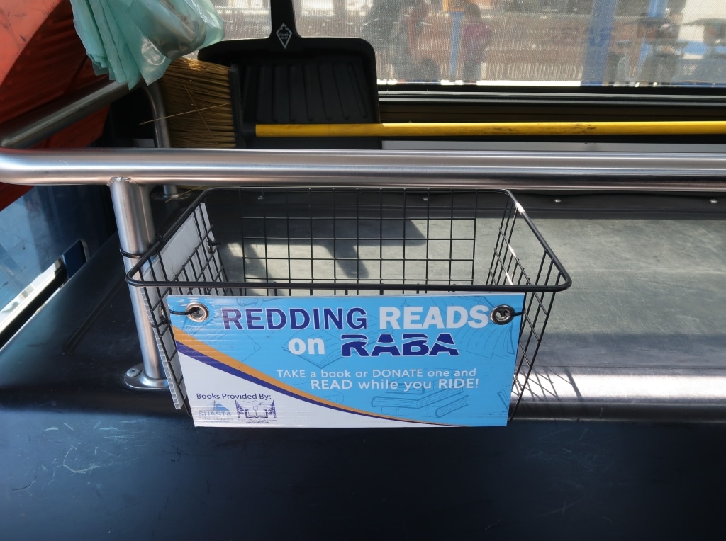 An empty wire basket with a sign that says "Redding reads on RABA."