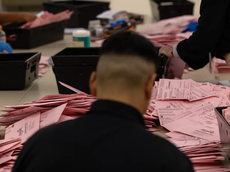 Election workers process ballots at the Sacramento County Voter Registration and Elections office in Sacramento on Nov. 5, 2024. Photo by Miguel Gutierrez Jr., CalMatters