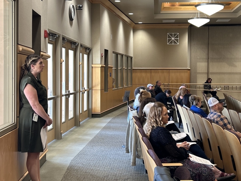 Former Assistant County Clerk and Registrar of Voters Joanna Francescut waits at the back of a boardroom in April 2024.